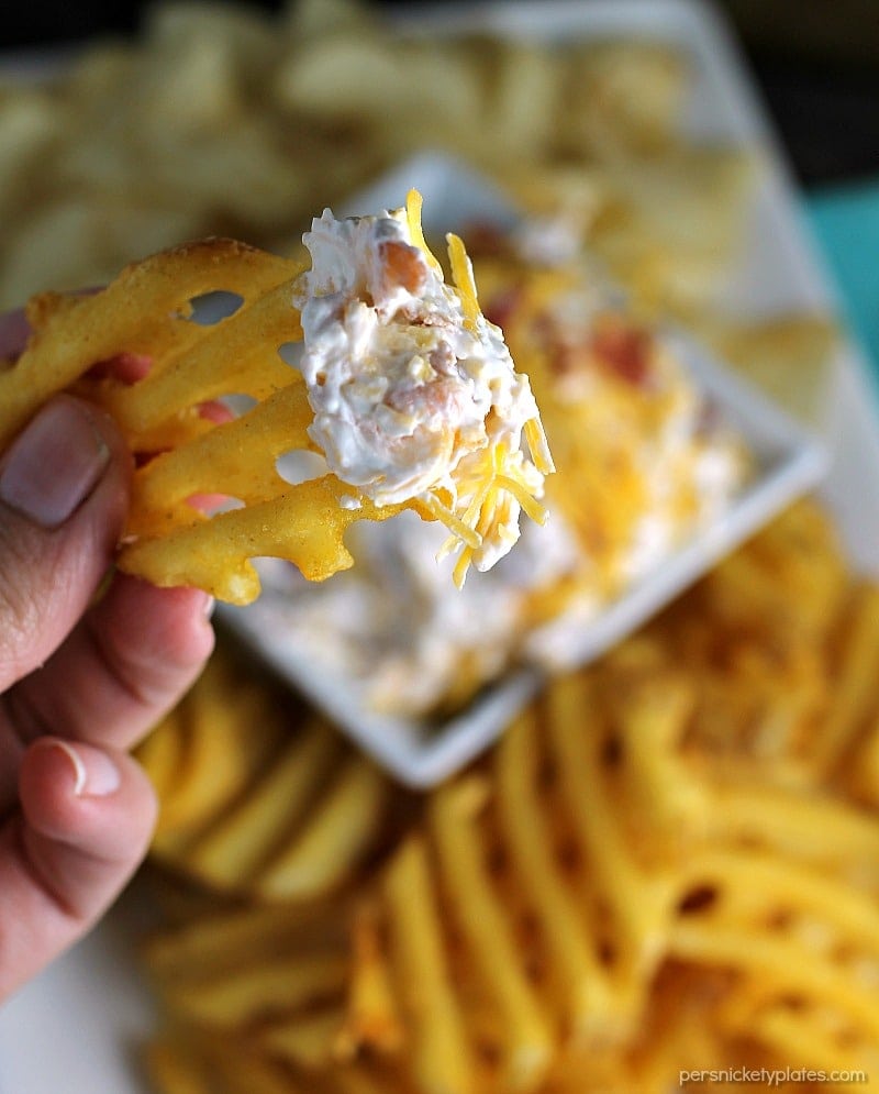Loaded Baked Potato Dip only has three ingredients and is perfect for game day snacking. If you love loaded baked potatoes, you'll love dipping your chips or potato wedges into this simple dip! | www.persnicketyplates.com