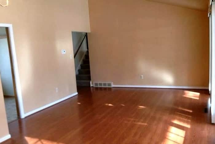 Before and after pictures of our living room/dining room done on a budget. Changing paint makes a huge difference - with Benjamin Moore Stonington Gray & Timber Wolf | Persnickety Plates