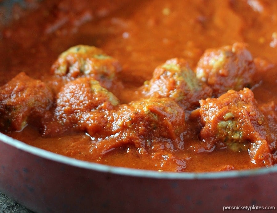 Easy Italian Chicken Meatball Subs smothered in a homemade marinara sauce and topped with provolone and mozzarella cheese! | Persnickety Plates