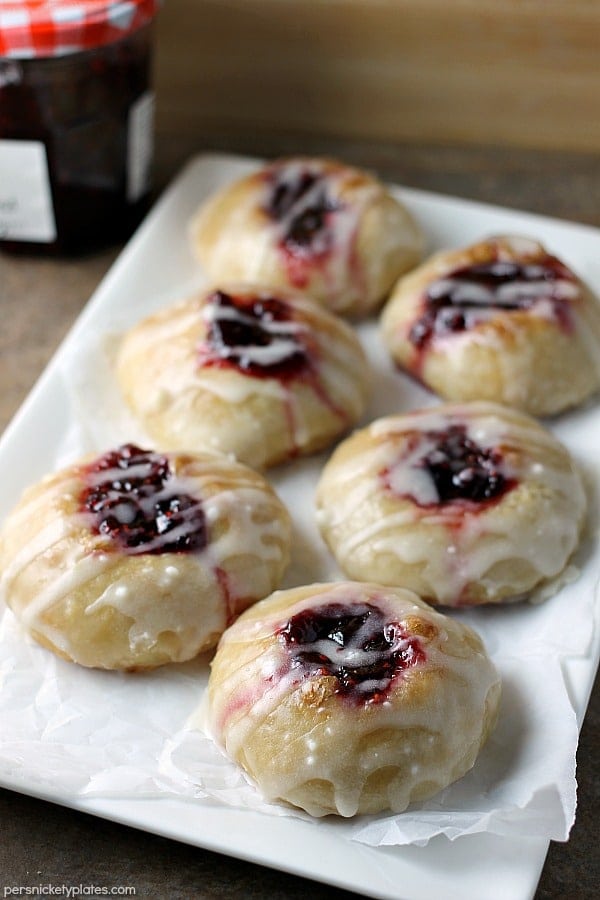 Two ingredients Raspberry Thumbprint Donuts are the perfect breakfast treat. Great to make with your kids! | Persnickety Plates Two ingredients Raspberry Thumbprint Donuts are the perfect breakfast treat. Great to make with your kids! | Persnickety Plates