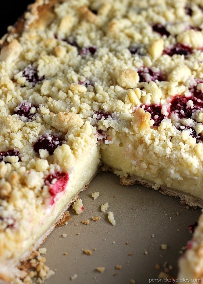 Raspberry Cream Cheese Crumb Cake is layered with a creamy cheesecake , fresh raspberries, and topped with a crunchy streusel topping. Perfect for brunch or dessert! | Persnickety Plates
