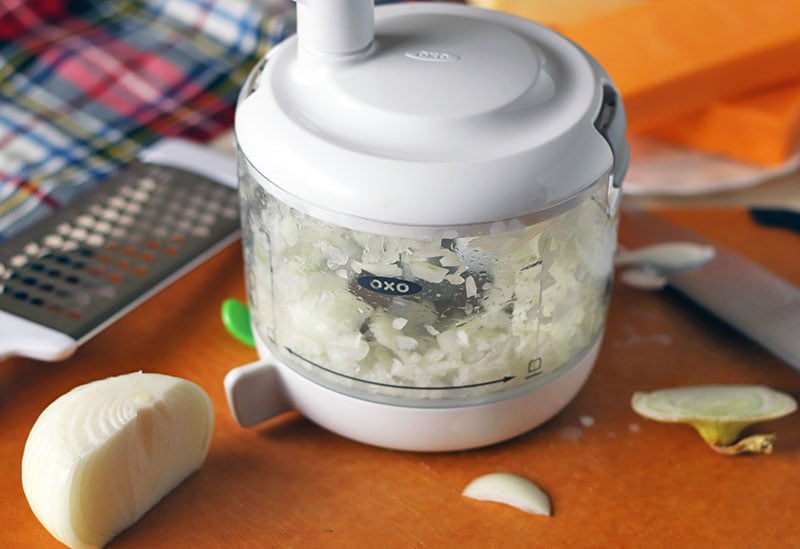 Homemade Baked Macaroni and Cheese is a delicious, super rich, five cheese baked mac and cheese recipe. This copycat steakhouse recipe is fancy enough to serve to guests for holidays, but so delicious, you'll want to make this easy baked mac and cheese recipe every day! onion chopper on cutting board