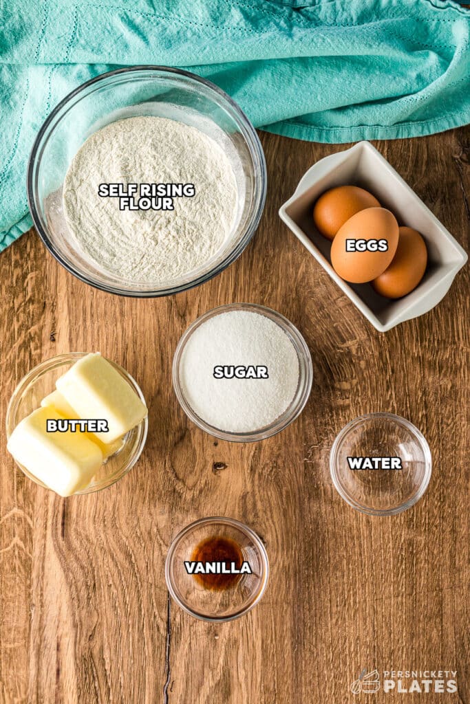 overhead shot of labeled ingredients laid out to make yellow cupcakes.