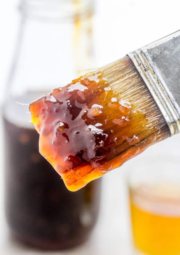 close up of pastry brush with jack daniel's sauce on it