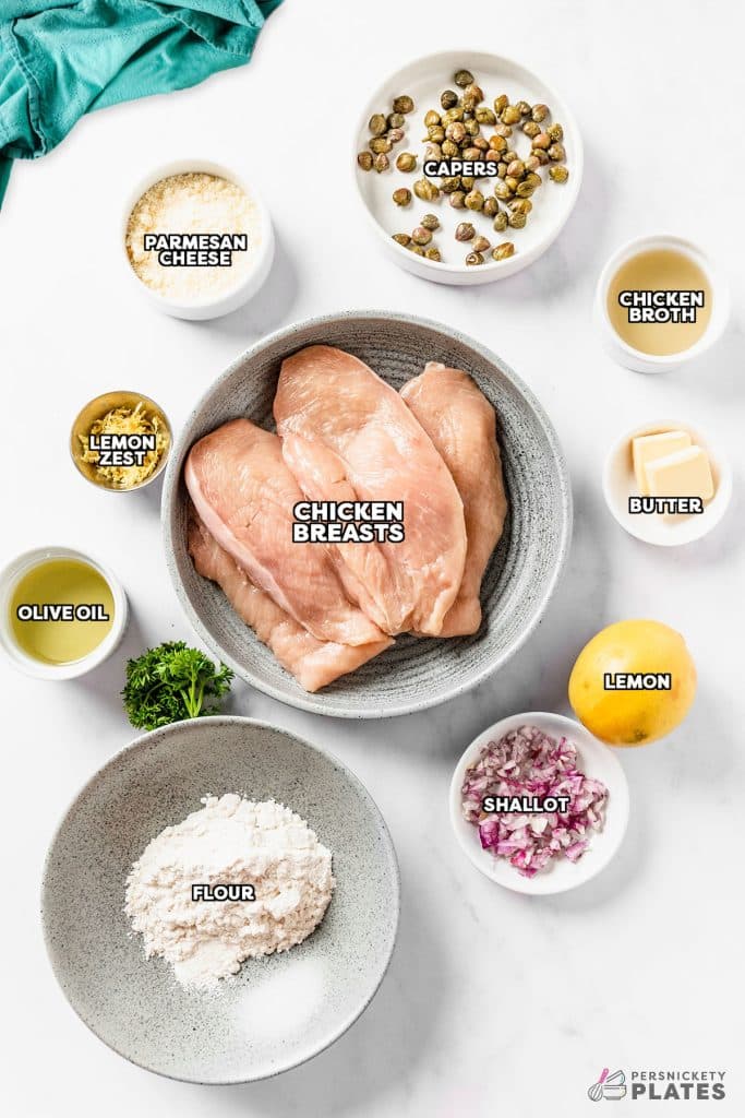 overhead shot of labeled ingredients laid out to make chicken piccata.