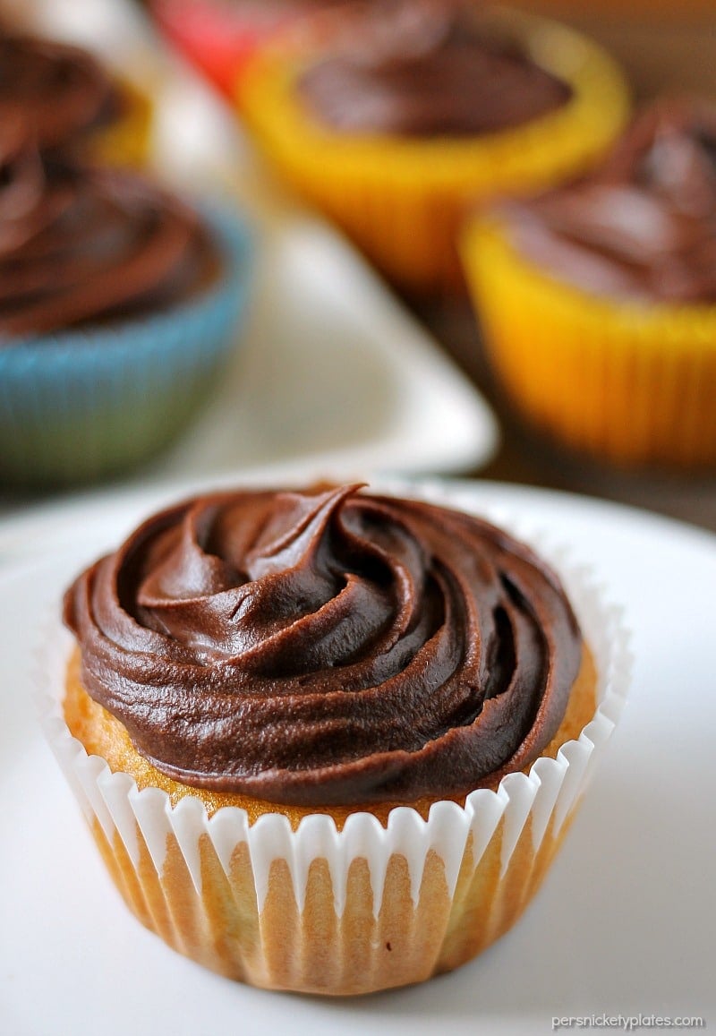 Cheesecake Filled Cupcakes are super simple starting with a cake mix but filled with chocolate chip cheesecake mixture in the centers! | www.persnicketyplates.com