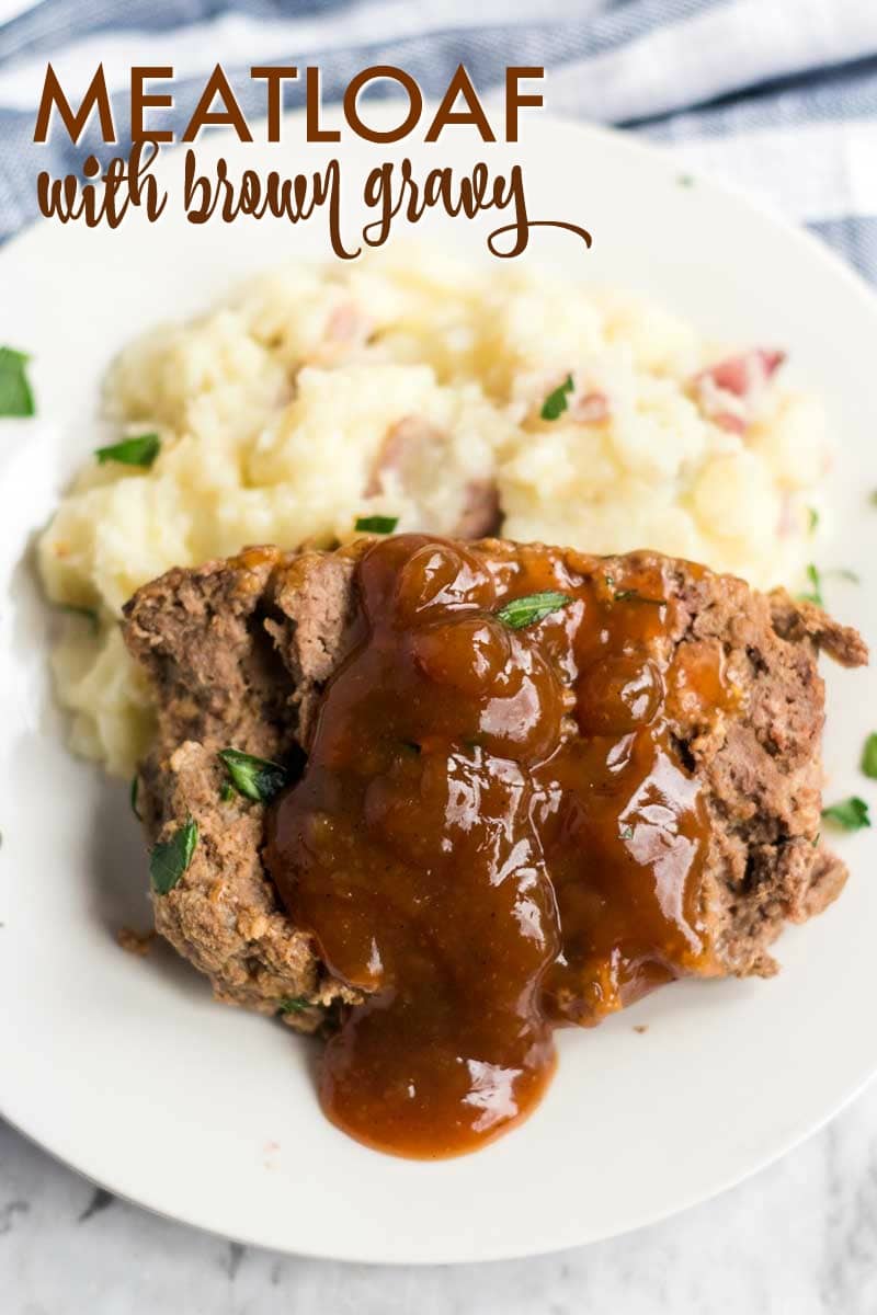 slice of meatloaf with brown gravy spooned over on mashed potatoes