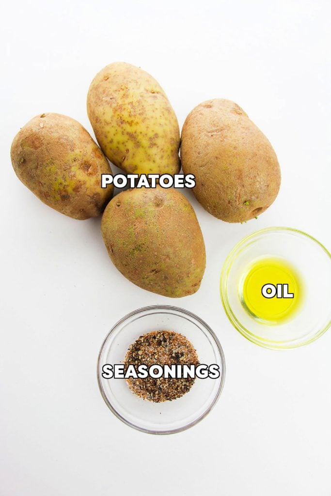 overhead shot of potatoes, seasonings, and oil.
