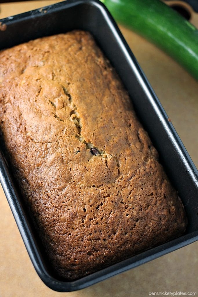 overhead shot of a loaf of zucchini bread in loaf pan.