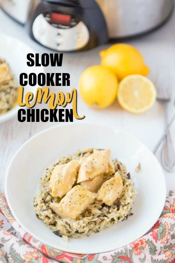 This Crock Pot Lemon Chicken is so easy and perfect for a busy weeknight. This 4 ingredient, quick chicken dinner is amazingly flavorful and sure to be your new favorite meal. Serve with vegetables and ready to serve rice for a fast healthy dinner! | www.persnicketyplates.com lemon chicken on wild rice with lemons & slow cooker in background