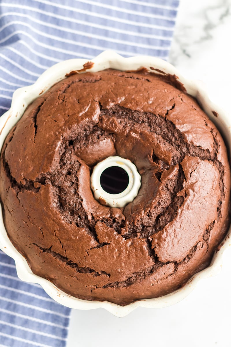 This rich, dense Sour Cream Chocolate Bundt Cake is a copycat of the famous Williams Sonoma recipe. Perfect for those chocolate cravings! | www.persnicketyplates.com overhead shot of chocolate bundt cake in pan