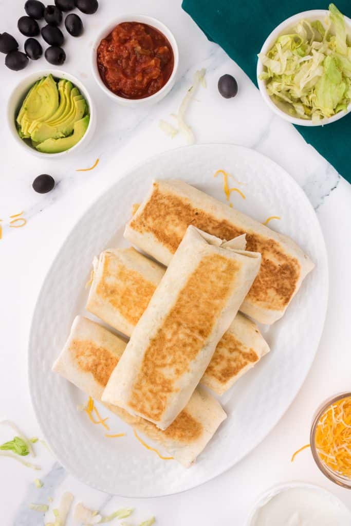 stack of toasted black bean wraps on a platter.