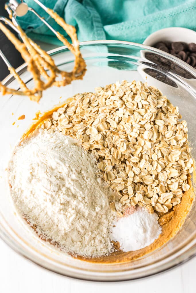 overhead shot of mixing bowl with oats, flour, and baking soda.