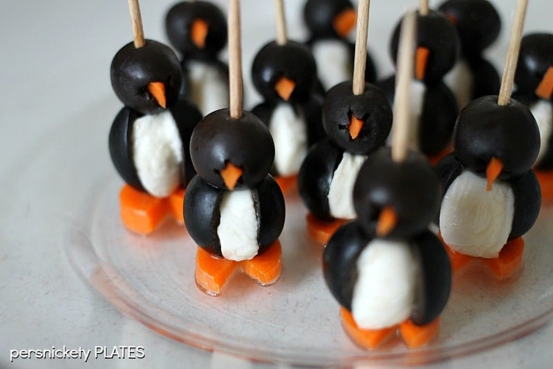 Olive Penguins These Olive Penguins are made with black olives, mozzarella balls, and carrots. They are an adorable and fun appetizer, perfect for game day or small gatherings. These delicious poppers are almost too cute to eat!