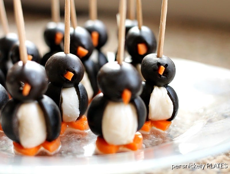 Olive Penguins These Olive Penguins are made with black olives, mozzarella balls, and carrots. They are an adorable and fun appetizer, perfect for game day or small gatherings. These delicious poppers are almost too cute to eat!