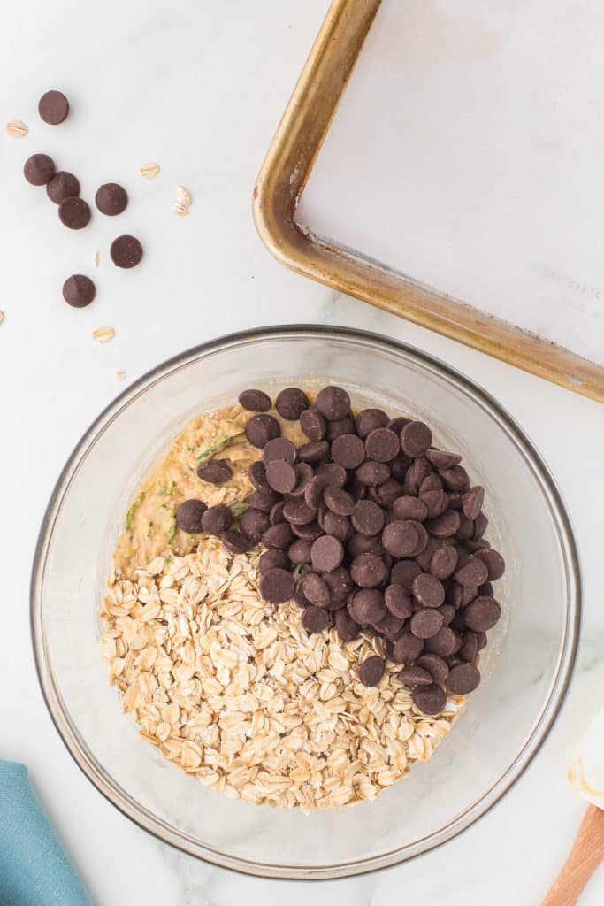 mixing bowl full of chocolate chips and oats.