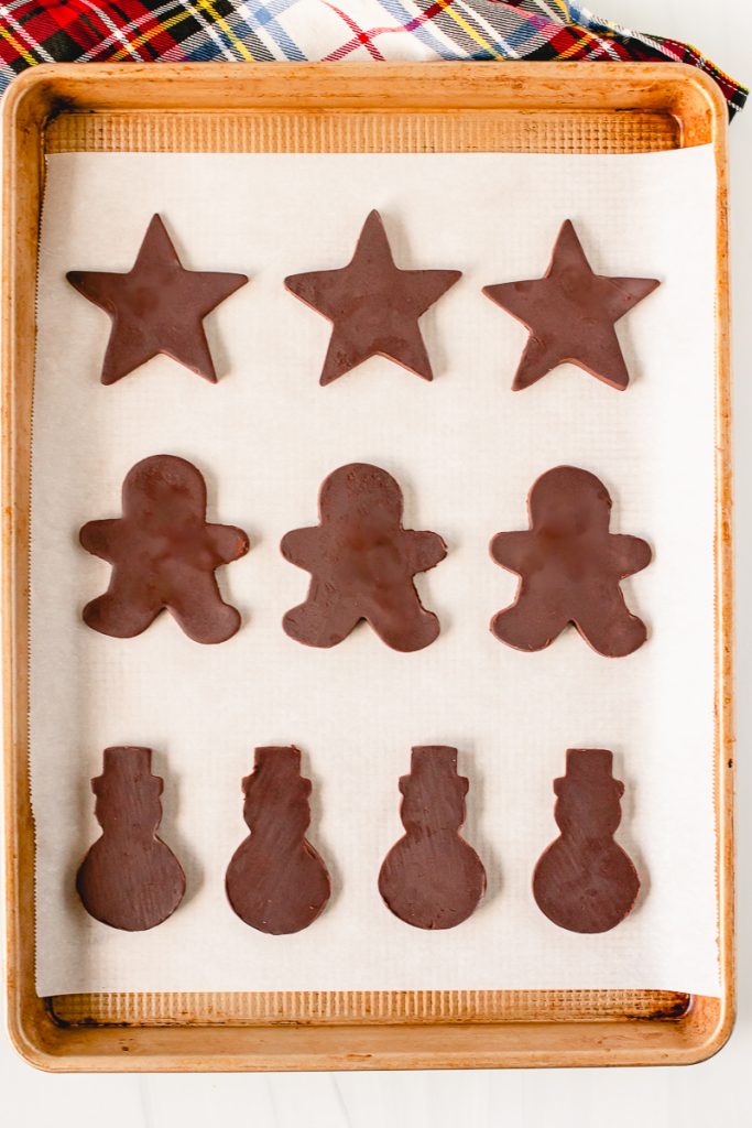 chocolate shaped cookies on a baking sheet