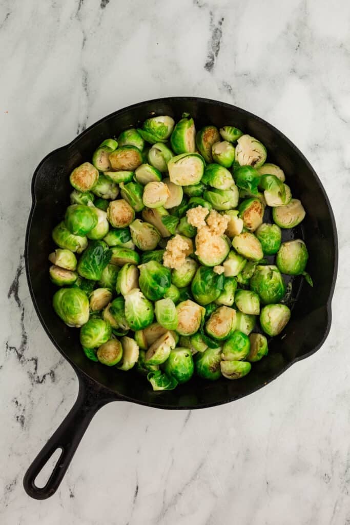 skillet with halved brussels sprouts.