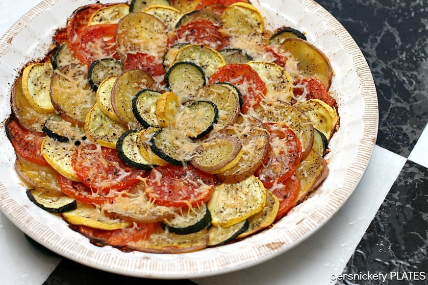 Vegetable Tian Vegetable Tian is a delicious vegetarian dish made with zucchini, squash, tomatoes, and red skin potatoes, baked together and sprinkled with cheese. This colorful vegetable recipe makes a beautiful side dish or a main vegetarian meal.