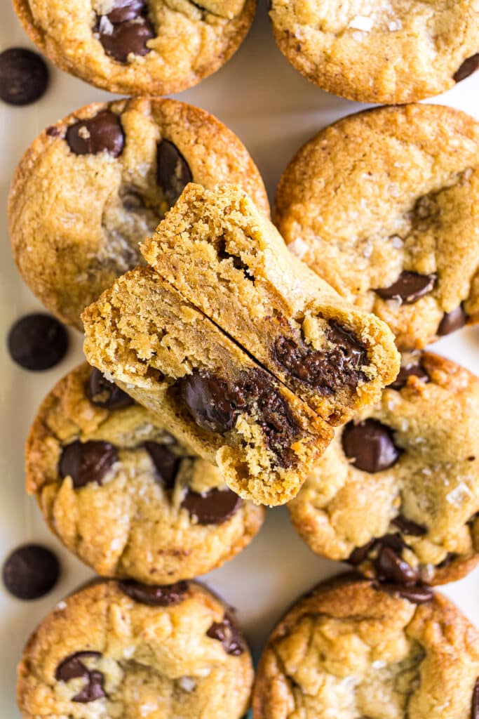 overhead shot of plate of cookie cups, one sliced in half.