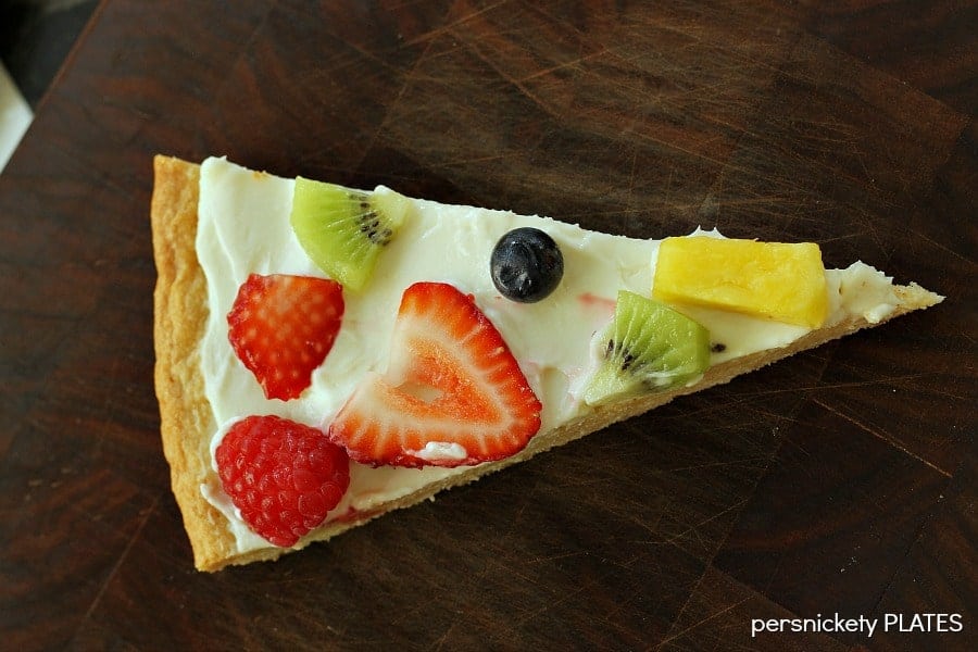 Sugar Cookie Fruit Pizza Sugar Cookie Fruit Pizza -a thin sugar cookie "crust" spread with a cream cheese "sauce" and topped with strawberries, raspberries, kiwi, blueberries, pineapple - whatever fruit you love!