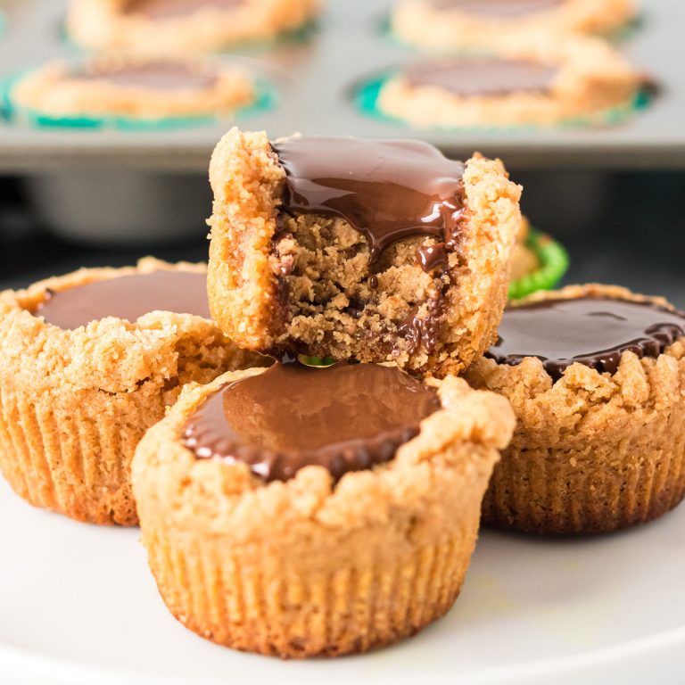 peanut butter cookie cup with a bite taken out of it.