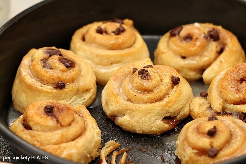 Chocolate Chip Cinnamon Rolls in baking dish Chocolate Chip Cinnamon Rolls will be your new best brunch idea! These simple cinnamon rolls take less than 10 minutes to prep and seconds to eat!