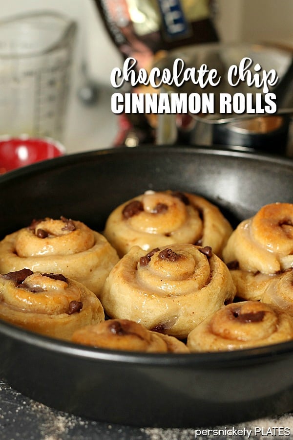 baking dish of chocolate chip cinnamon rolls fresh from oven Chocolate Chip Cinnamon Rolls will be your new best brunch idea! These simple cinnamon rolls take less than 10 minutes to prep and seconds to eat! | ww.persnicketyplates.com