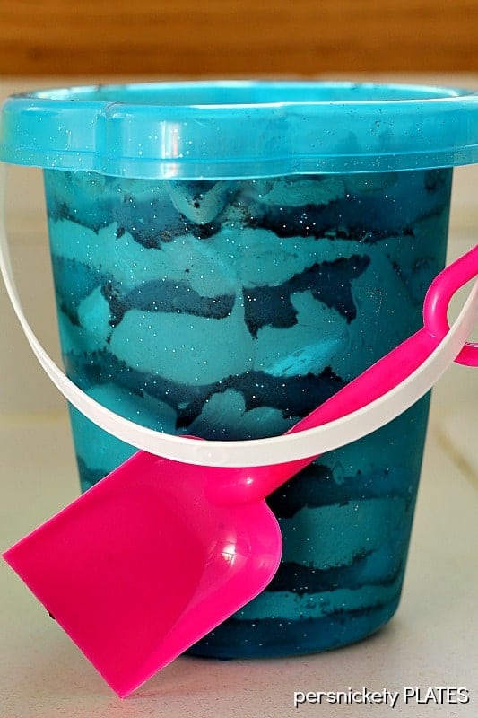 layers of chocolate dirt pudding in a bucket oreo dirt dessert in a bucket.