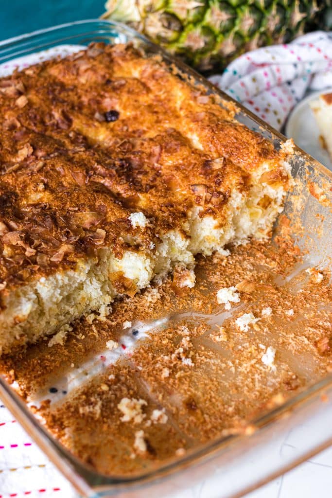side view of a pineapple angel food cake in a glass baking dish.