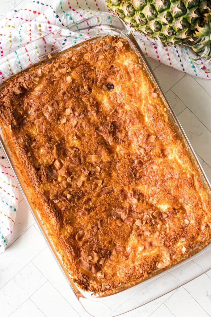 overhead shot of a pineapple angel food cake in a glass baking dish.