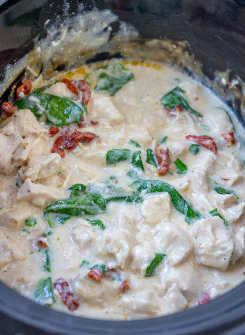 Five ingredient, super simple, Crock Pot Chicken Alfredo takes no time at all to throw together in the slow cooker. This easy crockpot chicken alfredo recipe will become a staple in your meal plan. 