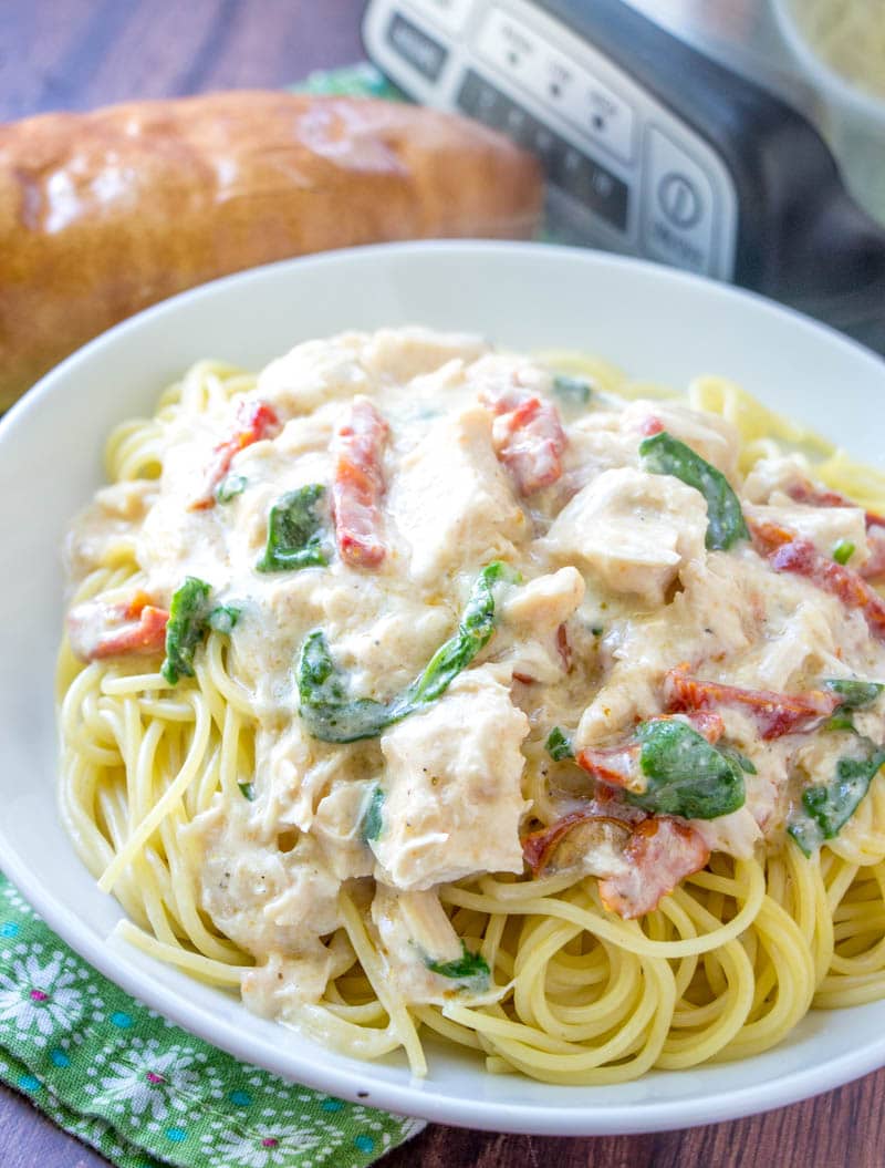 white bowl filled with crock pot chicken alfredo 