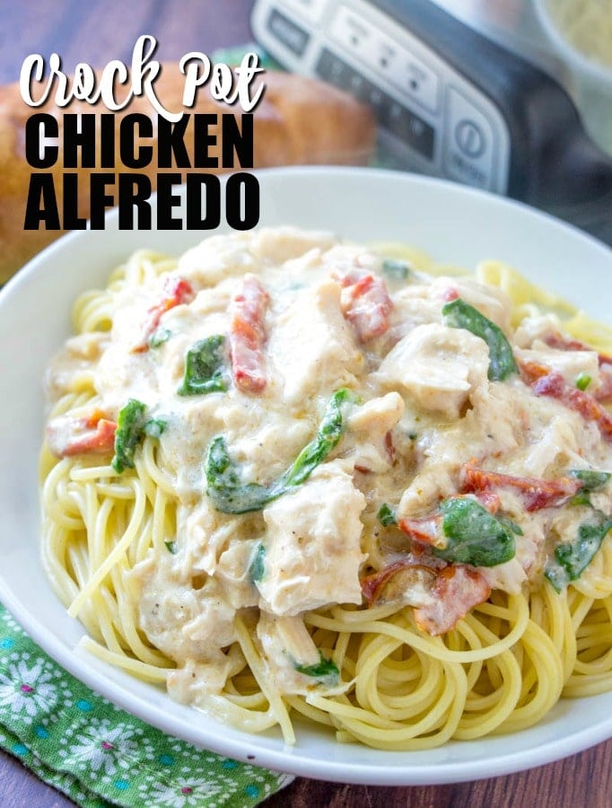 large white bowl of crock pot chicken alfredo pasta