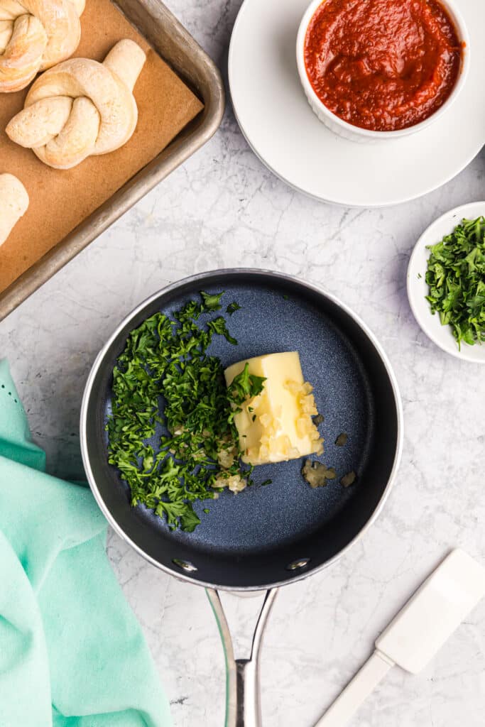 butter & chopped herbs in a saucepan.