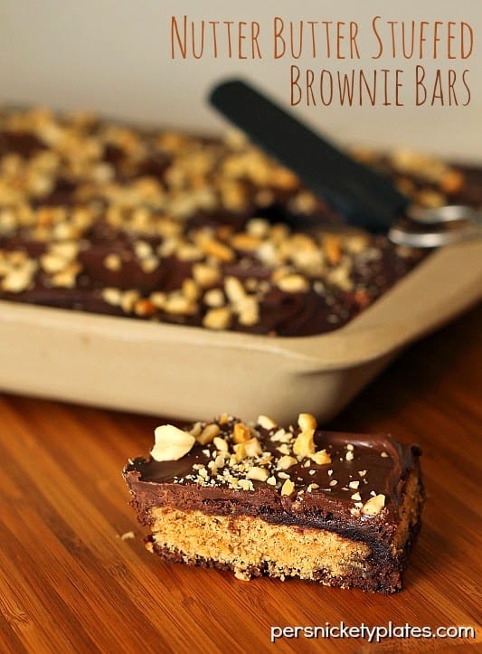 Nutter Butter Stuffed Brownie Bars Classic brownies stuffed with Nutter Butters, frosted, then sprinkled with peanuts | Persnickety Plates