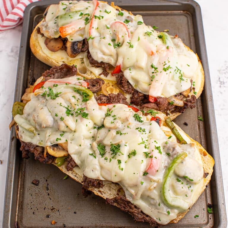 overhead shot of philly cheesesteak bread on a baking sheet.
