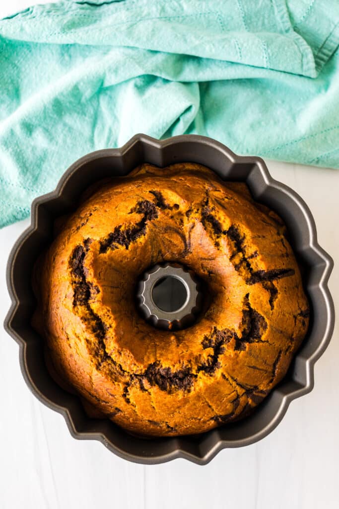 overhead shot of a pumpkin marble cake in a bundt pan.