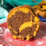 slice of pumpkin marble cake on a red plate.