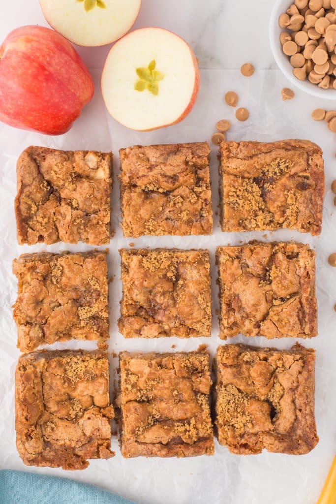 overhead shot of apple blondies sliced into 9 bars.