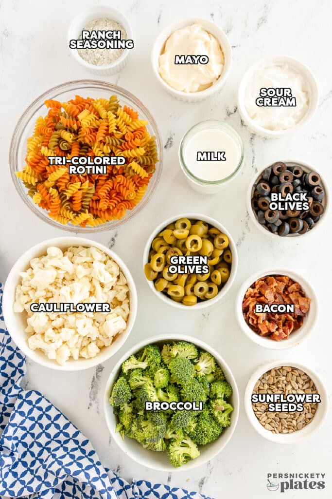 overhead shot of labeled ingredients laid out to make ranch bacon pasta salad.