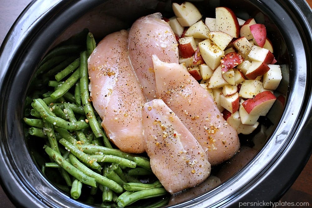 close up of green beans, chicken, and potatoes in slow cooker Slow Cooker Chicken, Potatoes, & Green Beans - your entire dinner made right in the crock pot! | www.persnicketyplates.com
