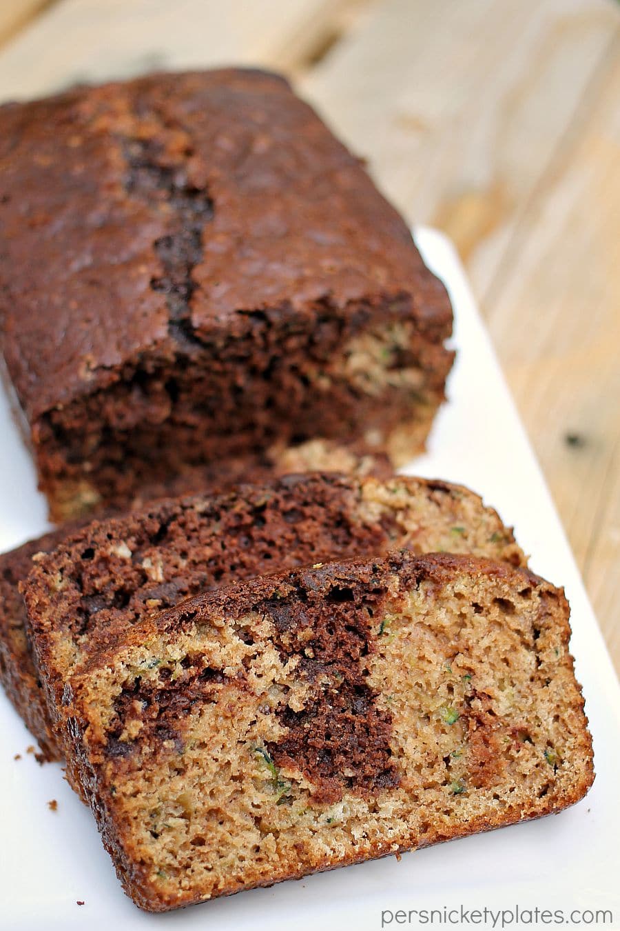 chocolate marble zucchini bread sliced on a white platter