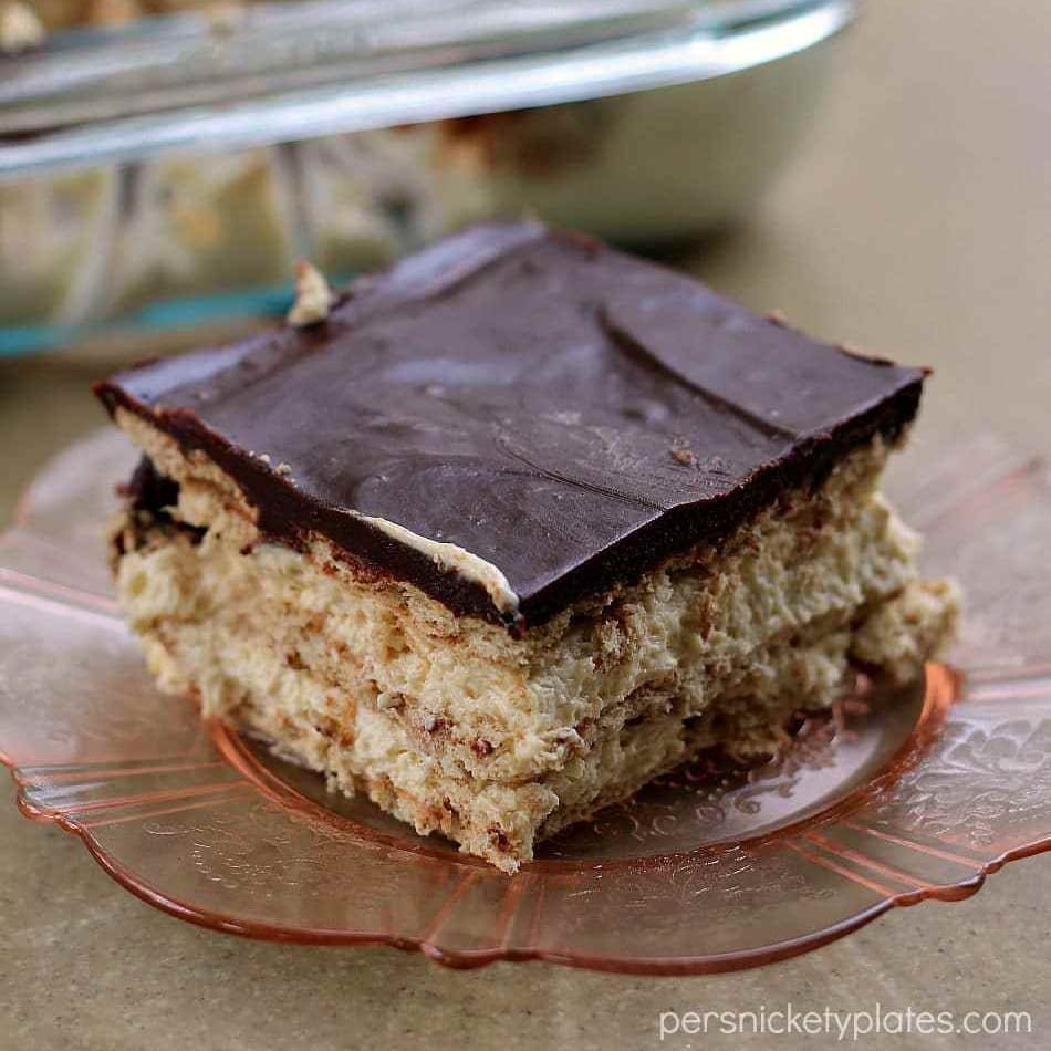 slice of chocolate peanut butter eclair dessert on pink plate 