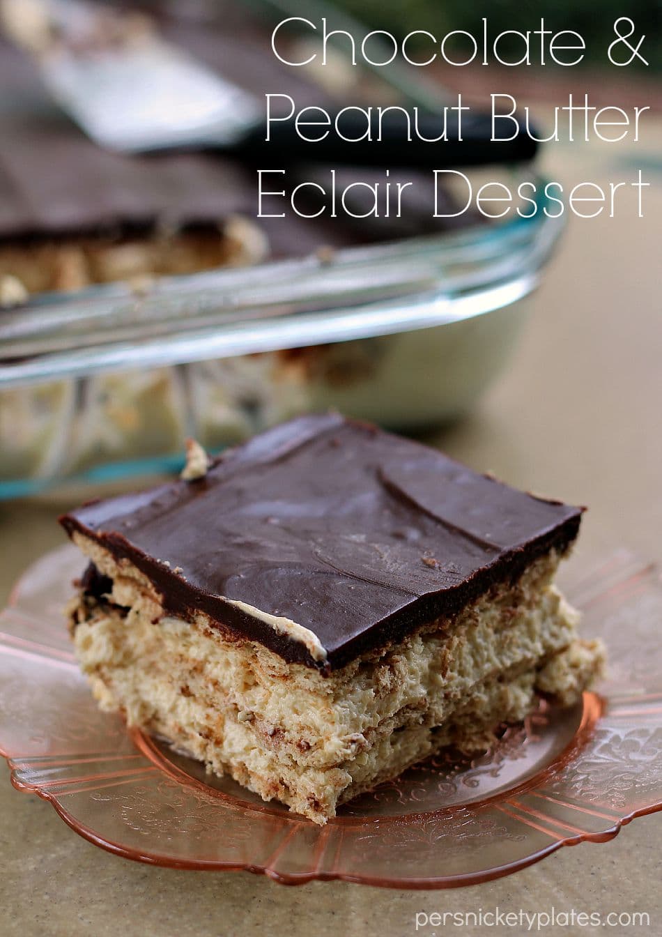 slice of chocolate eclair dessert with layers of peanut butter pudding on pink plate 
