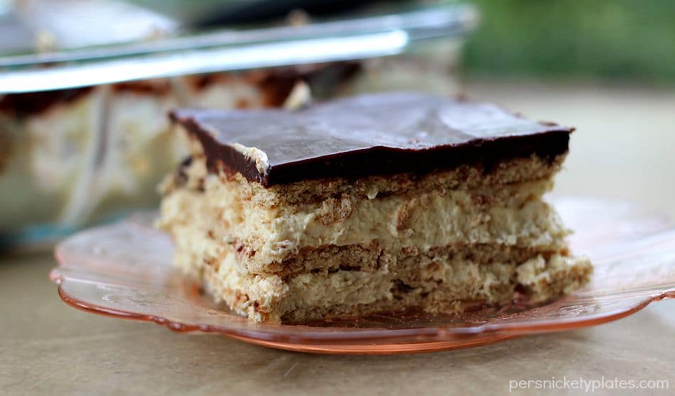 slice of layered chocolate eclair dessert on pink plate