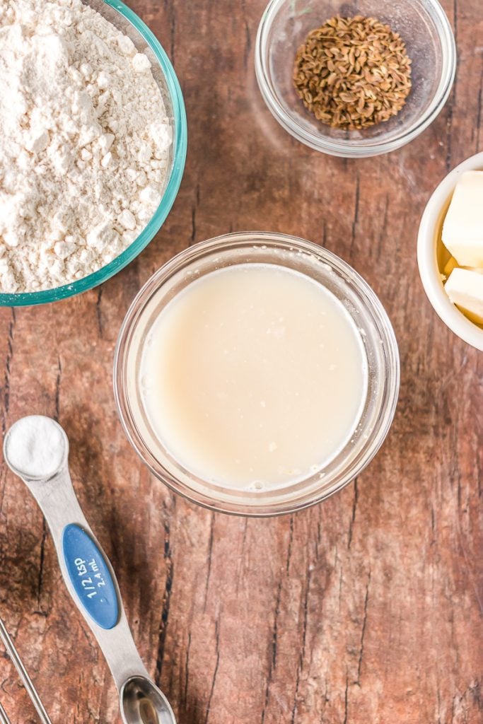 yeast dissolving in a bowl of warm water