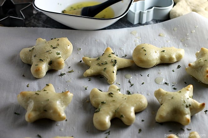 christmas shaped dinner rolls on a baking sheet