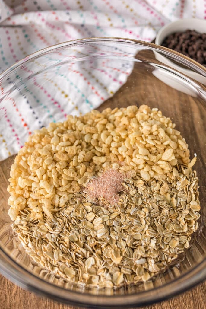 oats, rice krispies, and salt in a mixing bowl.