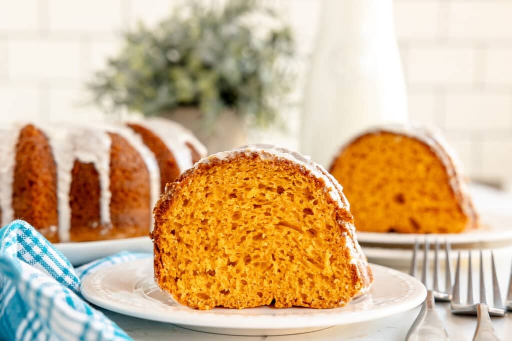slice of butterscotch bundt cake on a white plate.